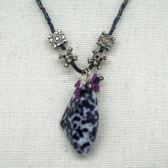 Necklace with assorted charms and stone. - Picture 4 of 5
